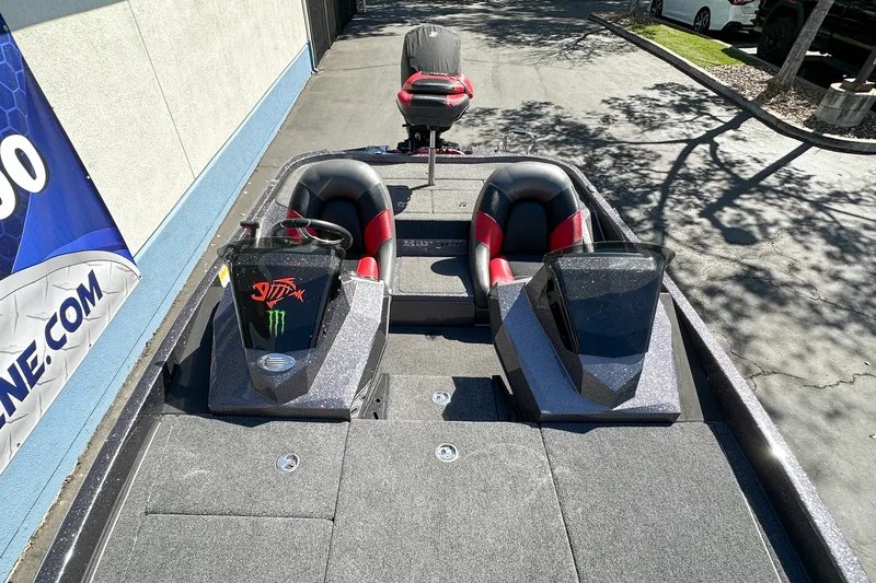 Slide: The Image of 2025 Ranger Z185 boat with dual seats and sleek design, parked outdoors. - 15