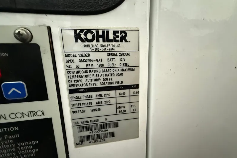 Slide: The Image of Kohler generator label on a 2009 Harbor Master Coastal 520, detailing specifications and ratings. - 7