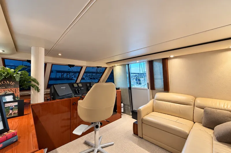 Slide: The Image of Luxurious interior of 2009 Harbor Master Coastal 520 yacht with leather seating and helm station. - 3