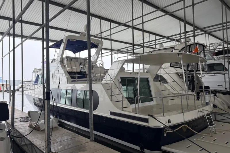 Slide: The Image of 2009 Harbor Master Coastal 520 yacht docked in a covered marina. - 1