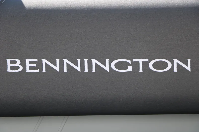 Slide: The Image of Close-up of the Bennington logo on a dark background. - 29