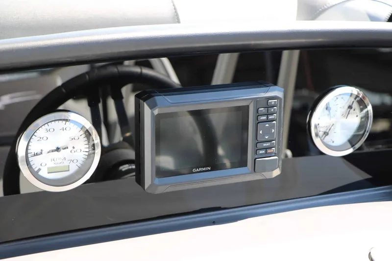 Slide: The Image of The image shows a modern dashboard with a Garmin navigation system and two analog gauges. - 36