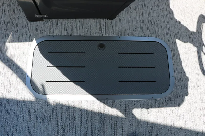 Slide: The Image of A gray flooring with a rectangular, slotted insert on a boat. - 33
