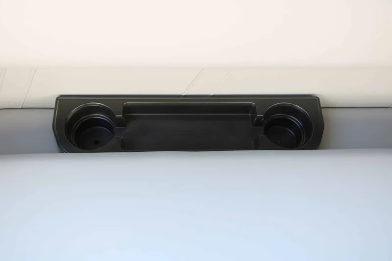 Slide: The Image of Close-up of a boat's cup holder with two round holders and a storage area. - 31