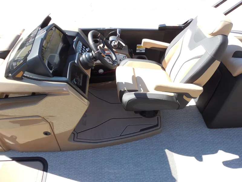 Slide: The Image of The image shows the cockpit of a 2027 Evotti 725 QL boat with a beige captain's chair and modern helm. - 16