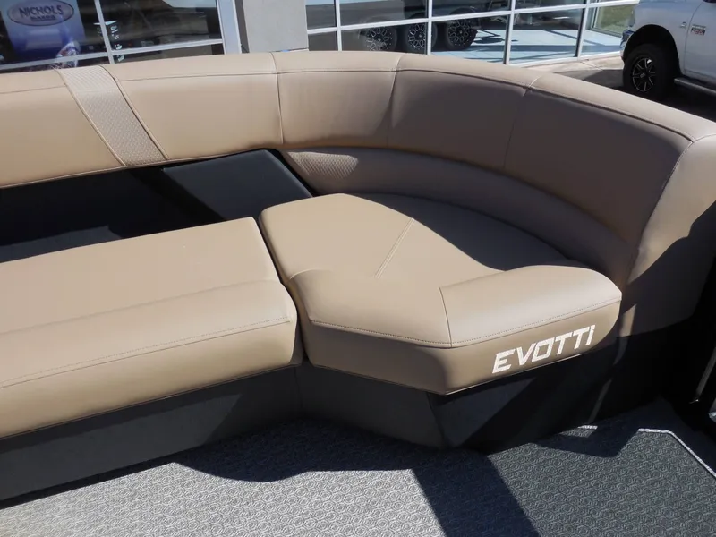 Slide: The Image of The image shows a beige seating area in a boat with the "EVOTTI" branding. - 14