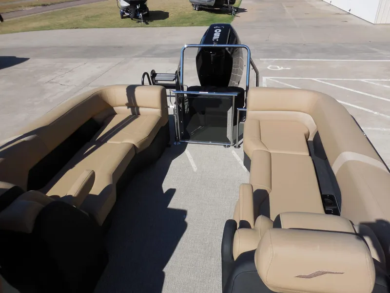 Slide: The Image of The image shows the interior of a 2027 Evotti 725 QL boat with beige seating. - 19