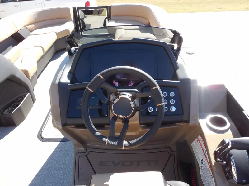 Slide: The Image of The image shows the cockpit of a 2027 Evotti 725 QL with a modern steering wheel and controls. - 25
