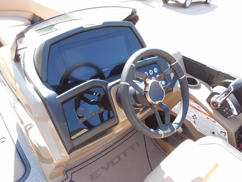 Slide: The Image of The image shows the helm of an Evotti 725 QL boat from 2027, featuring a modern steering wheel and large display. - 17