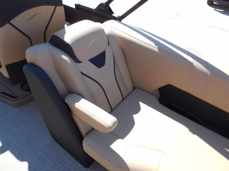 Slide: The Image of Beige leather seat with armrest in a modern boat, surrounded by black accents. - 20