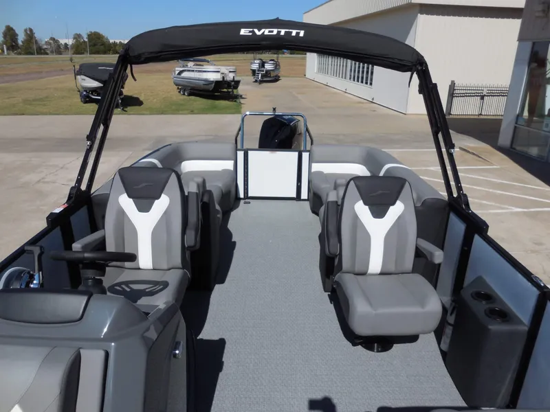 Slide: The Image of The image shows a modern boat with gray and white seats and a black sunshade. - 15