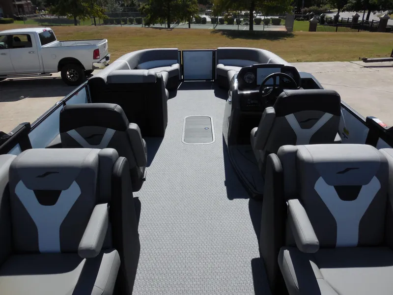 Slide: The Image of The image shows the interior of a 2027 Evotti 525 QL with gray seating and a helm station. - 23