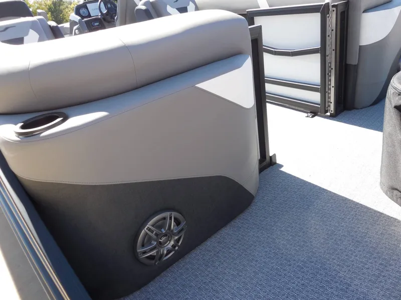 Slide: The Image of Interior of a 2027 Evotti 525 QL with gray upholstery and speaker. - 21