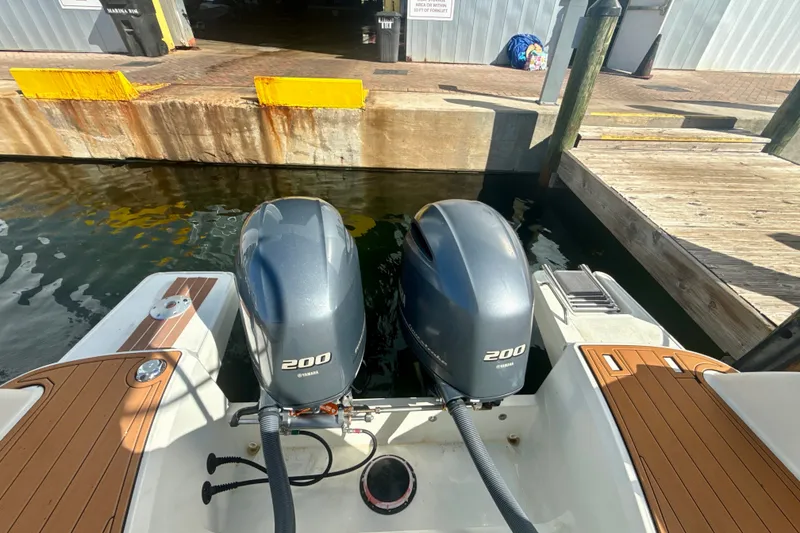 Slide: The Image of 2018 Jeanneau Cap Camarat 8.5 WA with twin Yamaha 200 engines at dock. - 4