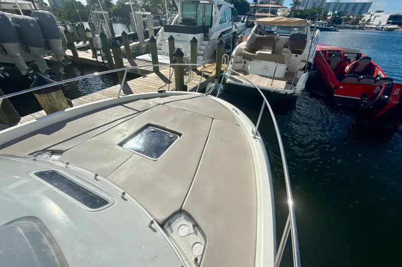 Slide: The Image of 2018 Jeanneau Cap Camarat 8.5 WA docked at marina, surrounded by other boats. - 22