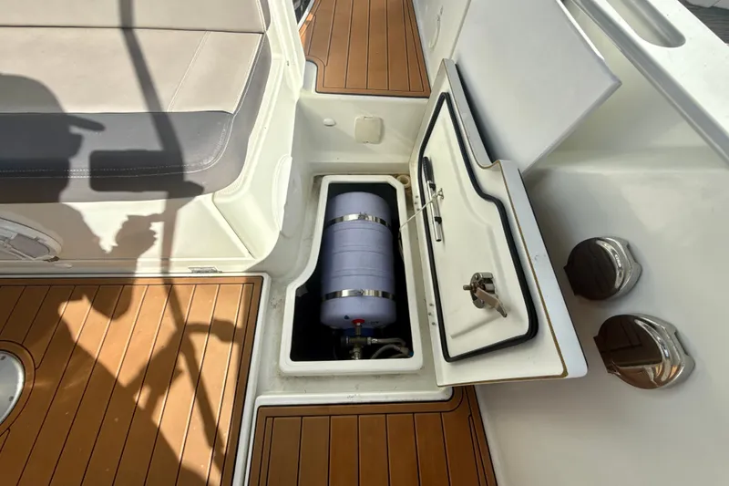 Slide: The Image of Storage compartment on 2018 Jeanneau Cap Camarat 8.5 WA boat, featuring teak flooring. - 9