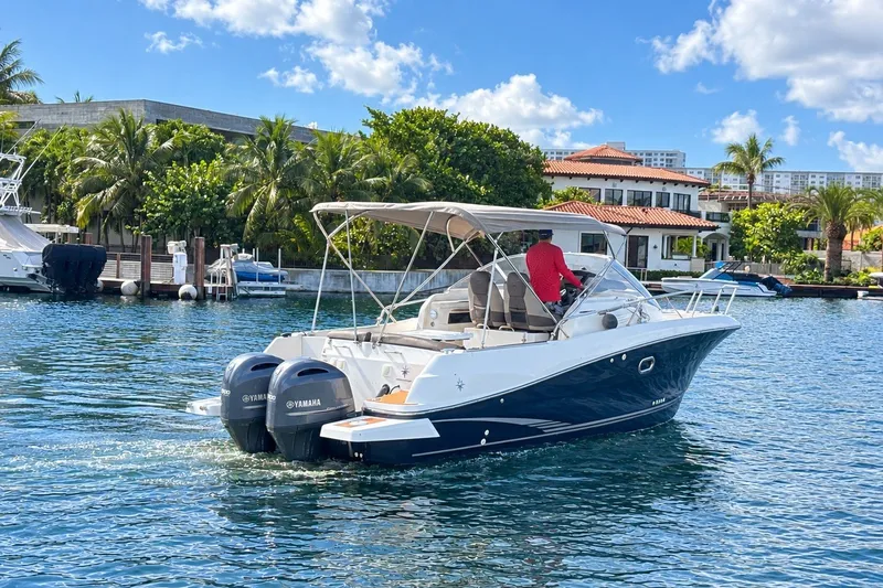 Slide: The Image of 2018 Jeanneau Cap Camarat 8.5 WA boat cruising on a sunny waterfront. - 2