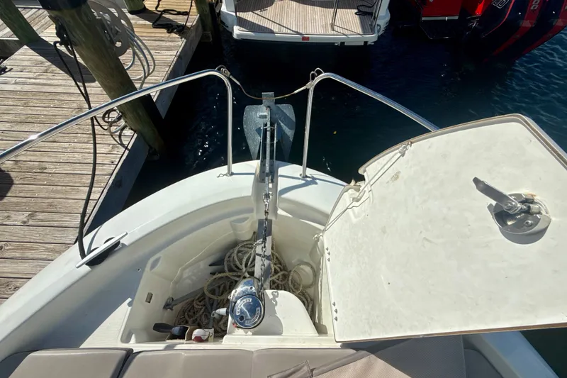 Slide: The Image of 2018 Jeanneau Cap Camarat 8.5 WA boat anchor compartment with ropes at dock. - 21