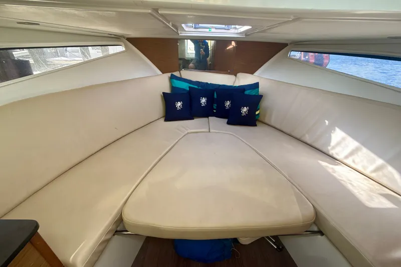 Slide: The Image of Interior of 2018 Jeanneau Cap Camarat 8.5 WA with beige seating and decorative pillows. - 15