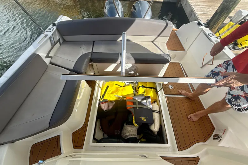 Slide: The Image of 2018 Jeanneau Cap Camarat 8.5 WA boat interior with storage compartment open. - 23