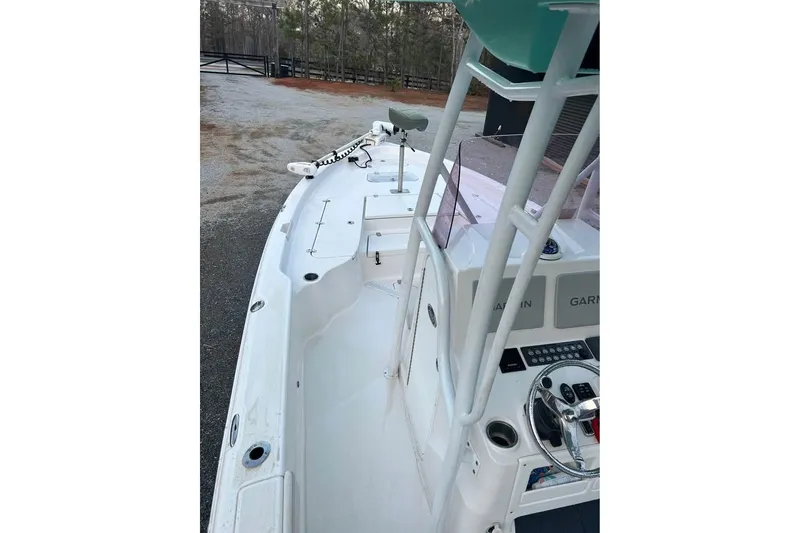 Slide: The Image of 2020 Blue Wave 2600 PureBay boat interior with steering console and navigation equipment. - 12