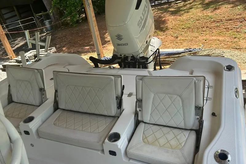 Slide: The Image of 2020 Blue Wave 2600 PureBay boat with Suzuki 300 engine and cushioned seating. - 5