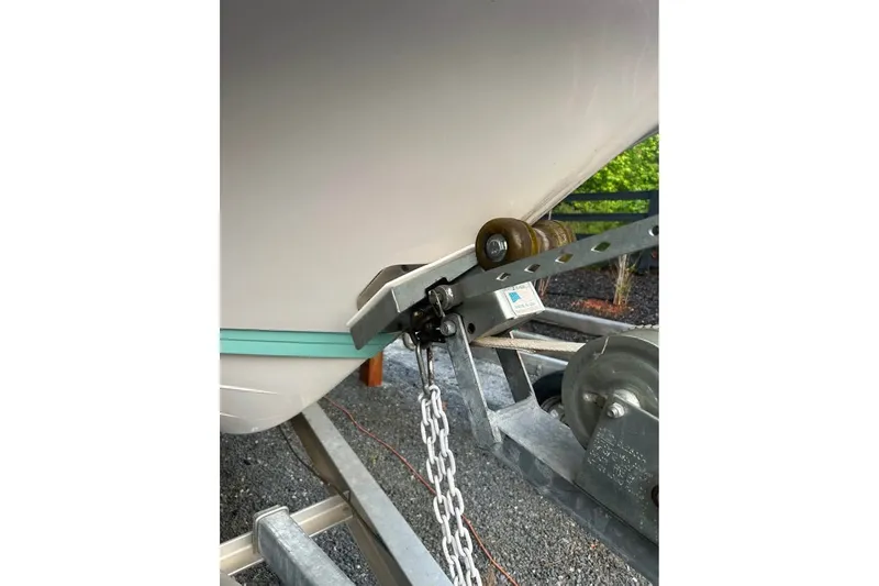 Slide: The Image of 2020 Blue Wave 2600 PureBay boat on trailer with chain and winch system. - 14