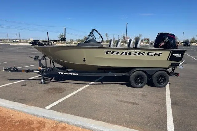 The Image of 2027 Tracker Targa V-18 Combo boat on trailer in parking lot. - 0