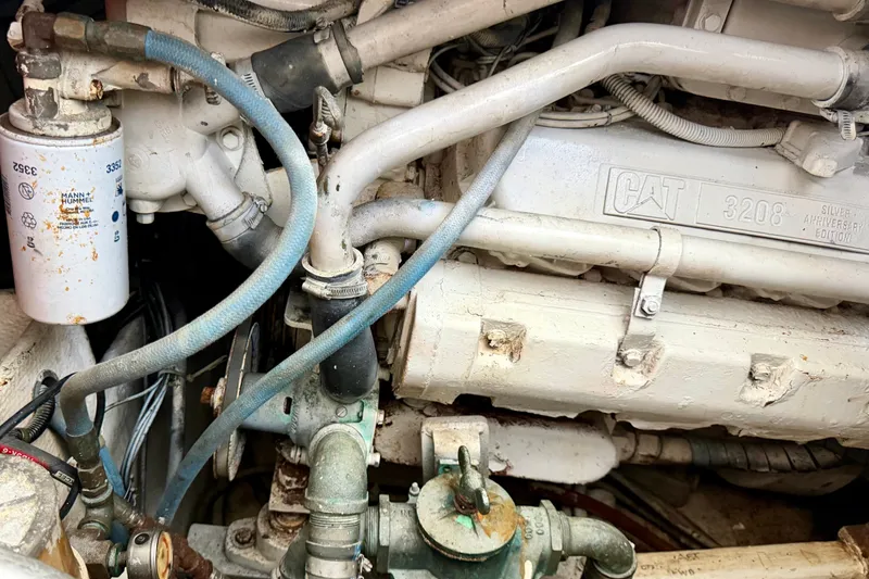 Slide: The Image of Engine compartment of a 1995 Cabo 35 Express boat with CAT 3208 engine. - 34