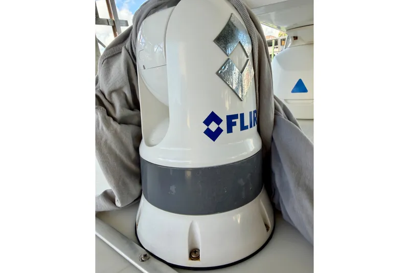 Slide: The Image of FLIR camera on 1995 Cabo 35 Express boat, partially covered by fabric. - 12