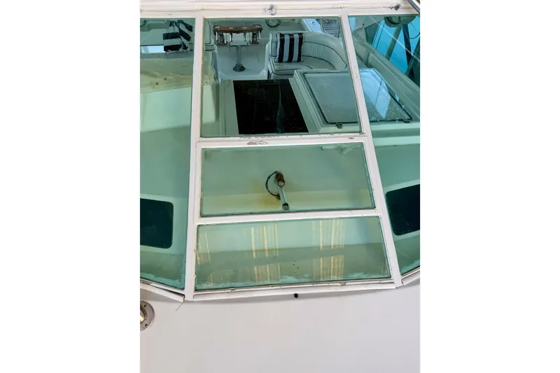 Slide: The Image of 1995 Cabo 35 Express boat interior view through windshield. - 9