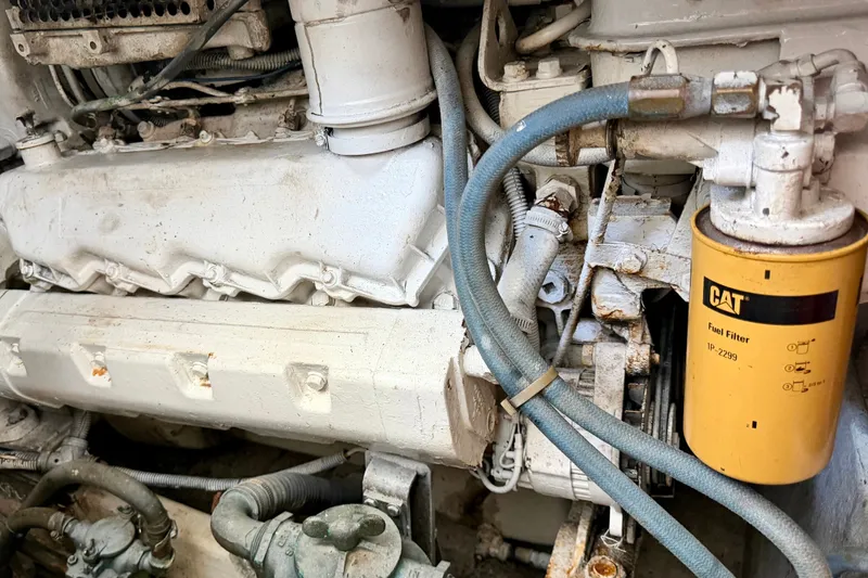 Slide: The Image of Engine compartment of a 1995 Cabo 35 Express boat with CAT fuel filter. - 32