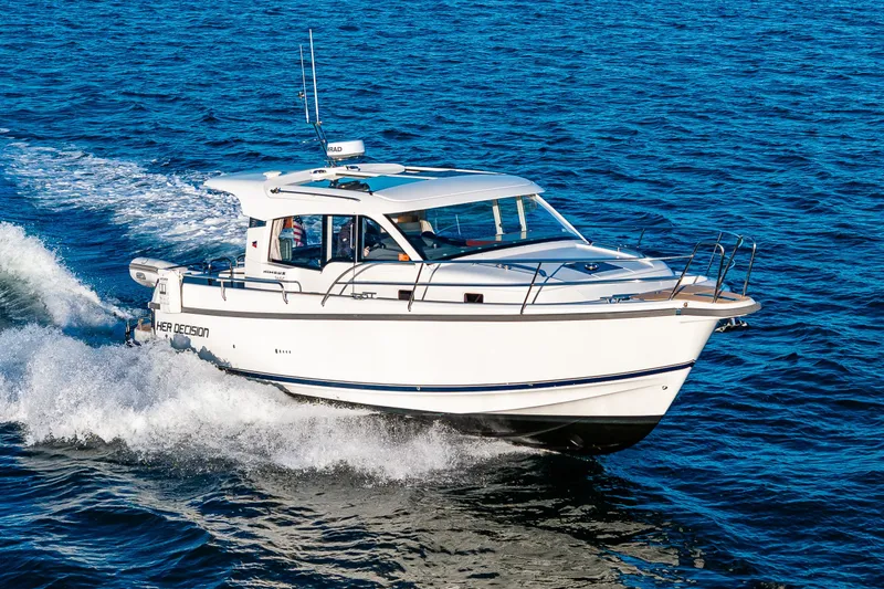 Slide: The Image of 2024 Nimbus 365 Coupe cruising on open water, showcasing sleek design and performance. - 32