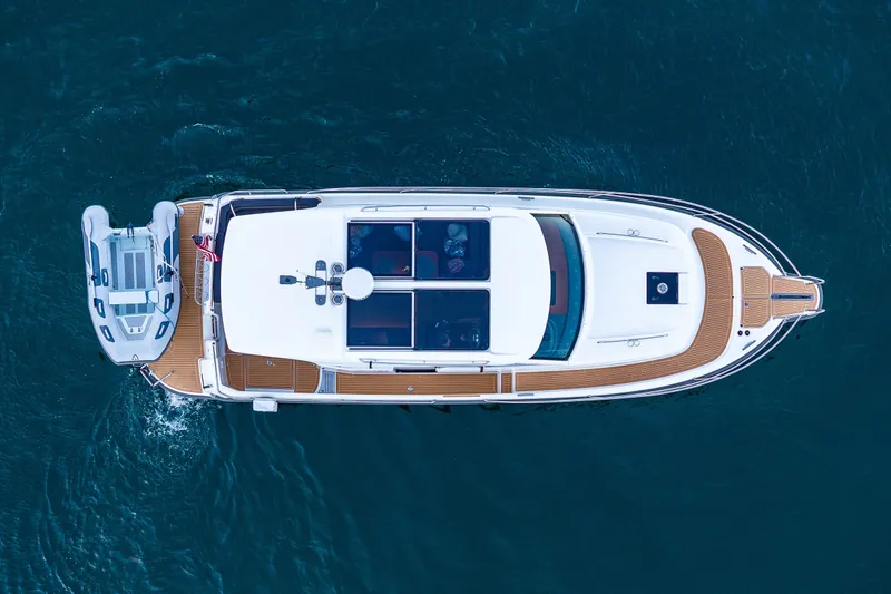 Slide: The Image of Overhead view of 2024 Nimbus 365 Coupe yacht on blue water. - 3