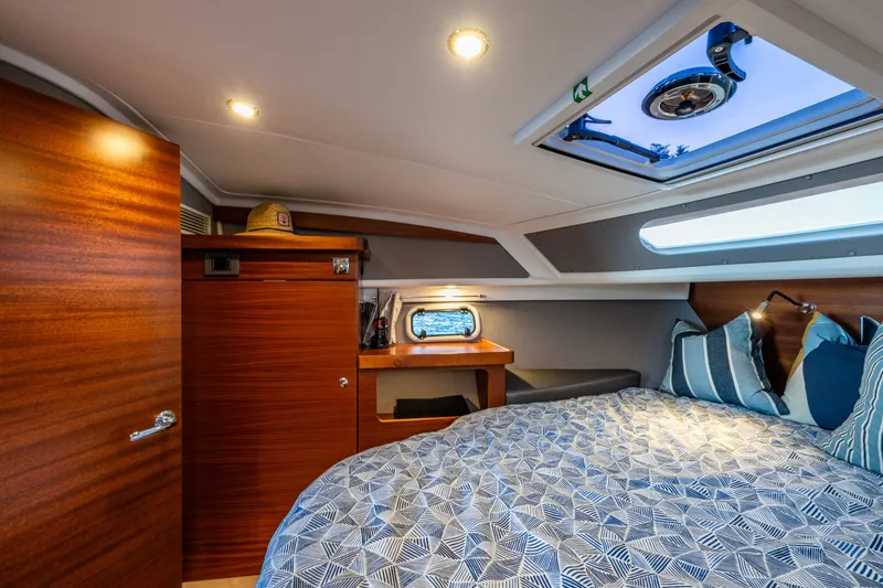 Slide: The Image of Luxurious cabin interior of 2024 Nimbus 365 Coupe with skylight and cozy bedding. - 17