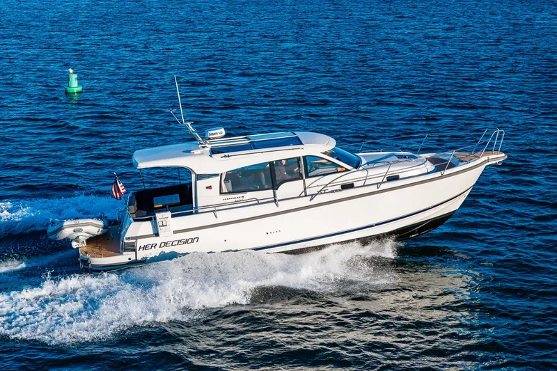 Slide: The Image of 2024 Nimbus 365 Coupe cruising on open water, showcasing sleek design and performance. - 1