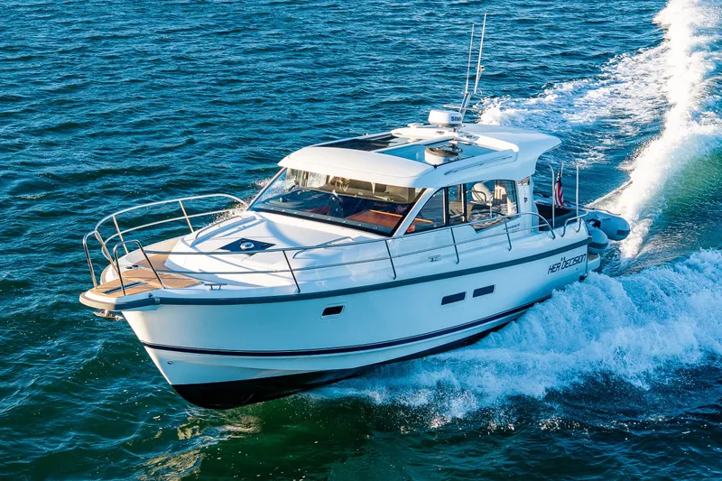 Slide: The Image of 2024 Nimbus 365 Coupe cruising on open water, showcasing sleek design and performance. - 33