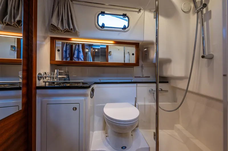 Slide: The Image of Luxurious bathroom in 2024 Nimbus 365 Coupe yacht, featuring modern fixtures and elegant design. - 21