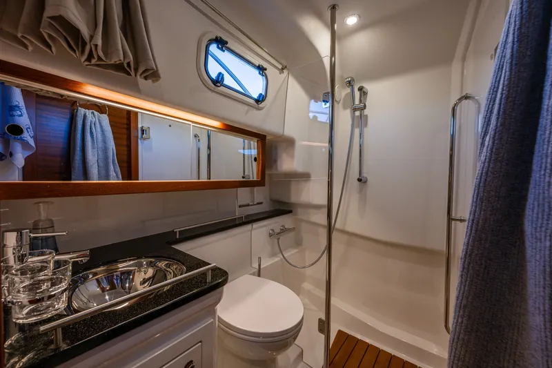 Slide: The Image of Luxurious bathroom interior of 2024 Nimbus 365 Coupe yacht, featuring modern fixtures and elegant design. - 20