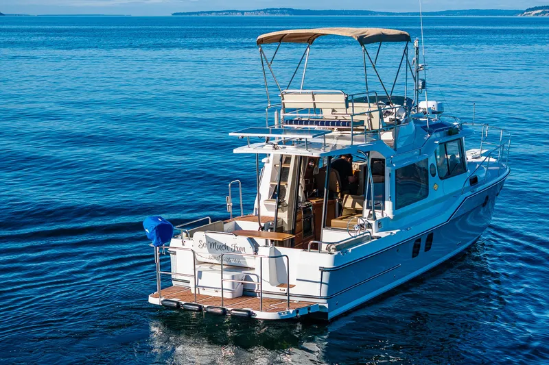 Slide: The Image of 2023 Ranger Tugs R-29 CB cruising on calm blue waters. - 32