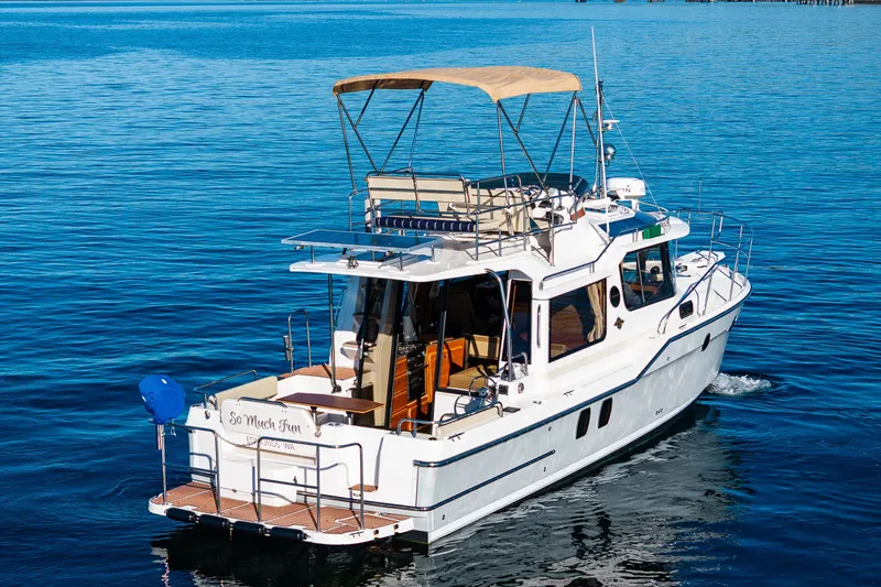Slide: The Image of 2023 Ranger Tugs R-29 CB cruising on calm blue waters. - 39