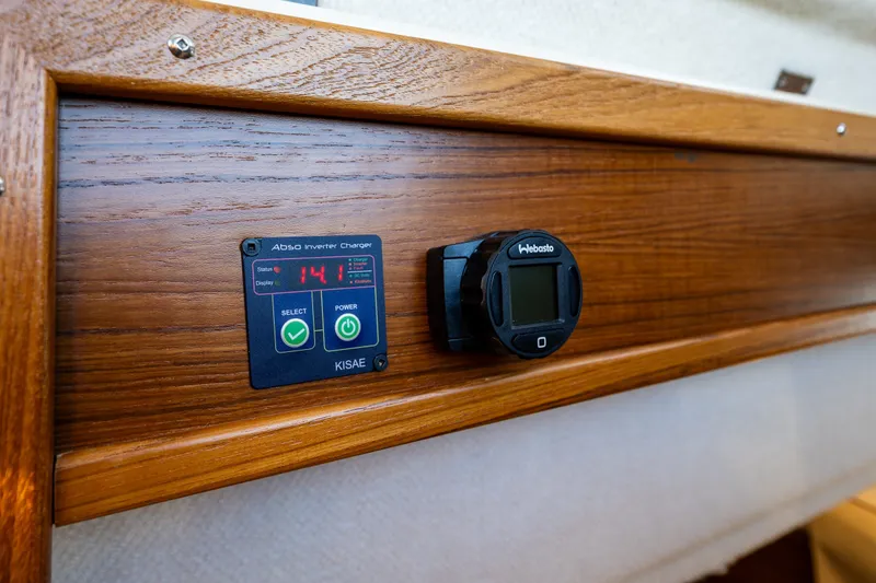Slide: The Image of 2023 Ranger Tugs R-29 CB interior with Kisae inverter charger and Webasto control panel. - 20