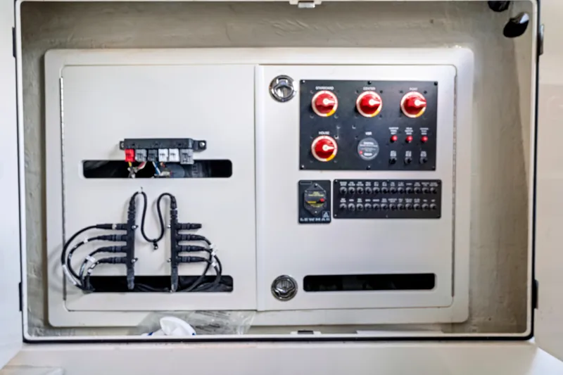 Slide: The Image of Electrical panel of a 2019 Sailfish 360 CC boat, featuring switches and wiring. - 31