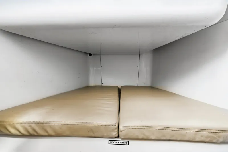 Slide: The Image of Interior storage compartment of 2019 Sailfish 360 CC boat with cushioned seating. - 33