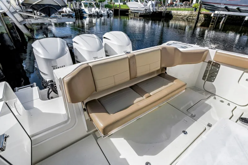 Slide: The Image of 2019 Sailfish 360 CC boat with foldable seating and triple Yamaha outboard engines. - 15