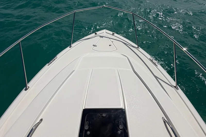 Slide: The Image of Bow view of 2017 Pursuit OS 325 Offshore boat on open water. - 51