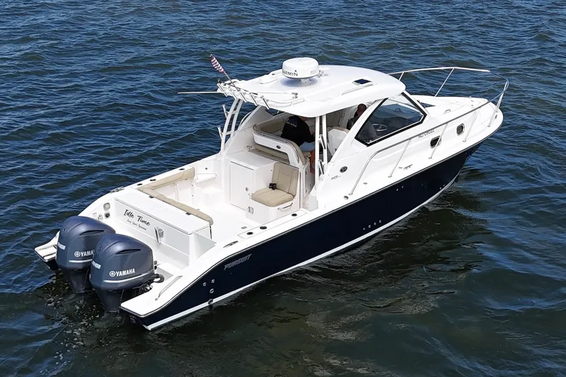 Slide: The Image of 2017 Pursuit OS 325 Offshore boat with twin Yamaha engines on open water. - 6