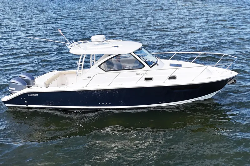 Slide: The Image of 2017 Pursuit OS 325 Offshore boat cruising on open water. - 2