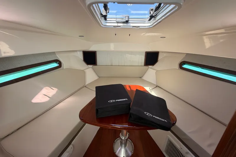 Slide: The Image of Interior cabin of 2017 Pursuit OS 325 Offshore boat with seating and table. - 37