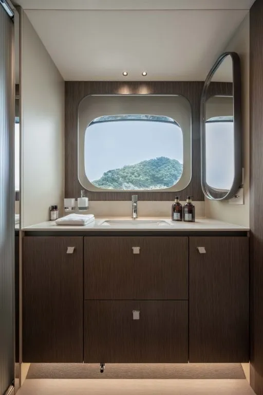 Slide: The Image of Modern bathroom with large window and wood paneling, offering a view of the landscape. - 18